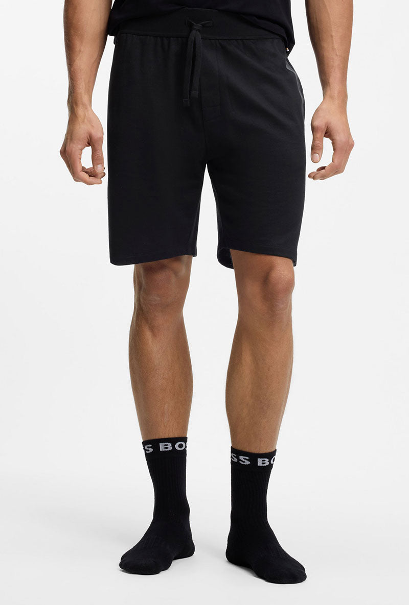 Front image of a model wearing Boss authentic shorts in black, by brand Boss