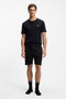 Front image of a model wearing the Boss authentic shorts in black, by brand Boss
