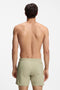 Back image of a model wearing the Boss iconic swimshorts in beige, by brand Boss