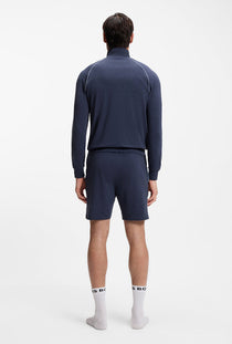 Back image of a model wearing the Boss mix & match shorts in navy, by brand Boss