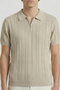Front detail image of a model wearing the Deep colin zip polo in beige, by brand Deep