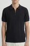Front detail image of a model wearing the Deep colin zip polo in black, by brand Deep