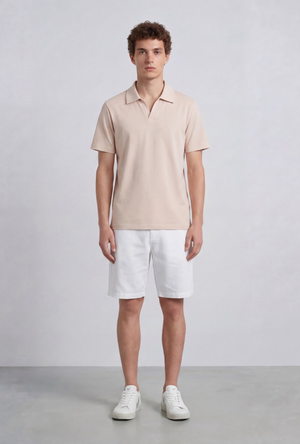 Front image of a model wearing the Deep leroy polo in peach, by brand Deep