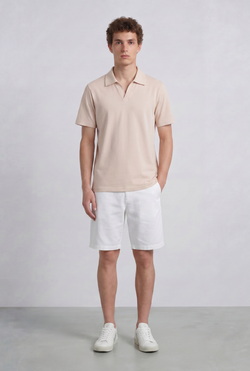 Front image of a model wearing Deep leroy polo in peach, by brand Deep