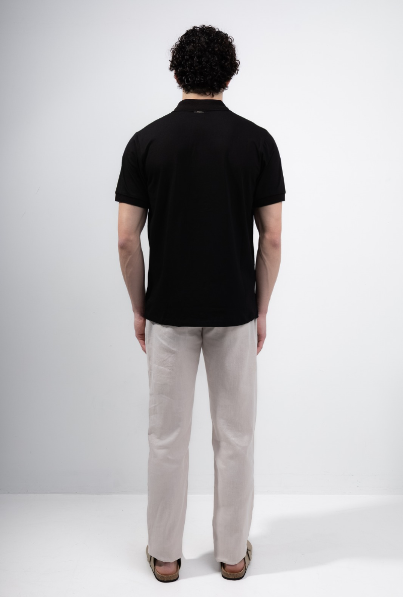 Back image of a model wearing Deep premium polo in black, by brand Deep