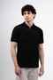 Front image of a model wearing the Deep premium polo in black, by brand Deep