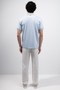 Back image of a model wearing the Deep premium polo in blue, by brand Deep