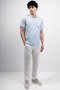 Front image of a model wearing Deep premium polo in blue, by brand Deep