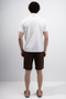 Back image of a model wearing the Deep premium polo in white, by brand Deep