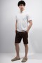 Front image of a model wearing Deep premium polo in white, by brand Deep