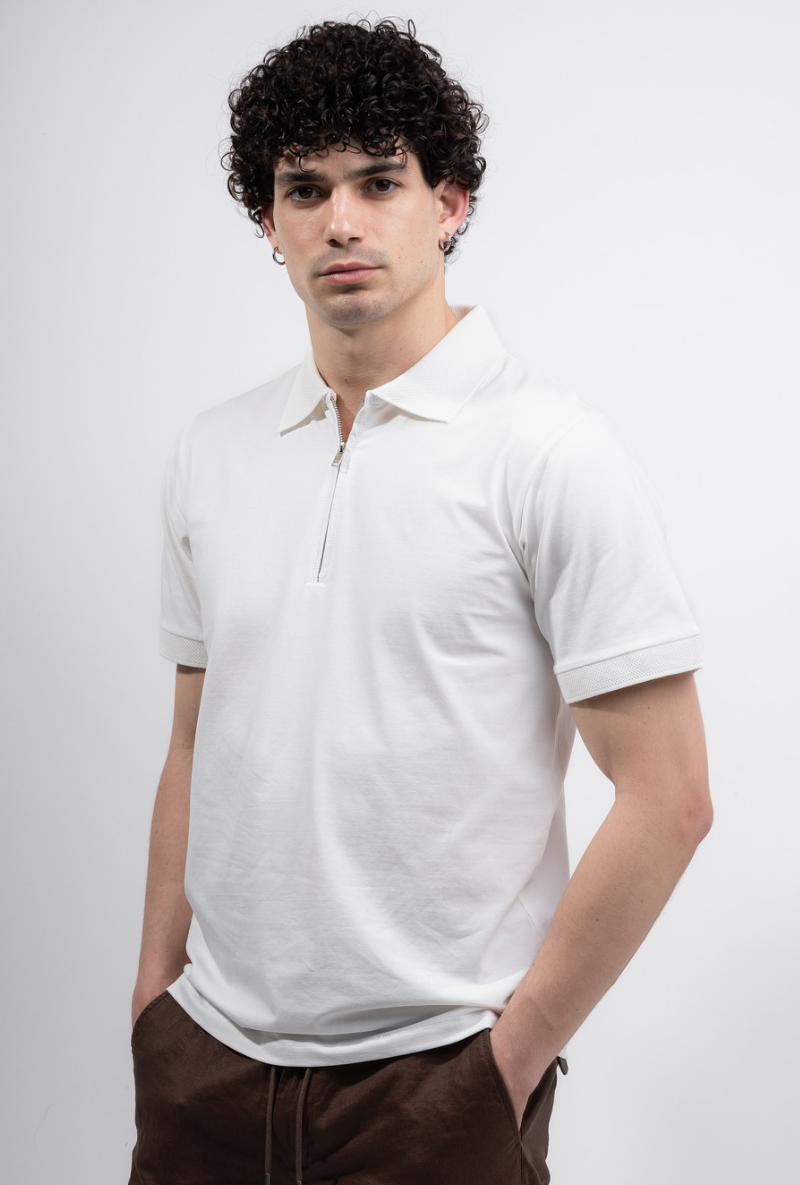 Front image of a model wearing Deep premium polo in white, by brand Deep