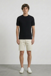 Front image of a model wearing the Deep rex crew neck rib knit in black, by brand Deep