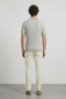 Back image of a model wearing the Deep riley stripe polo in grey, by brand Deep