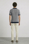 Back image of a model wearing the Deep riley stripe polo in navy, by brand Deep