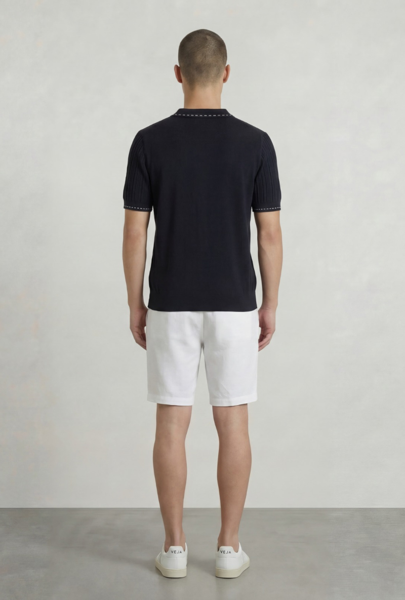 Back image of a model wearing Deep river button knit polo in black, by brand Deep