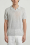 Front image of a model wearing the Deep rocco open neck polo in light grey, by brand Deep
