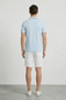Back image of a model wearing the Deep roman button polo in light blue, by brand Deep