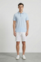 Front image of a model wearing Deep roman button polo in light blue, by brand Deep