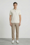 Front image of a model wearing Deep roman button polo in white, by brand Deep
