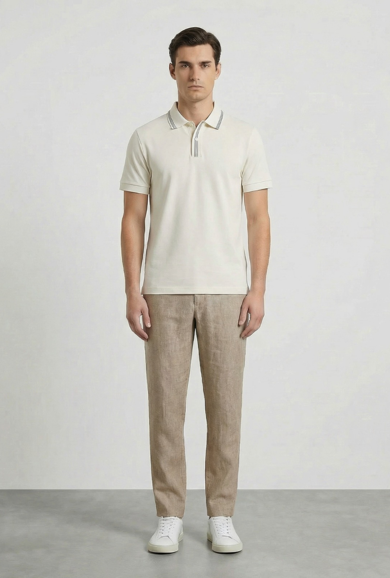 Front image of a model wearing Deep roman button polo in white, by brand Deep