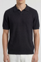 Front image of a model wearing the Deep rory open neck polo in black, by brand Deep