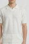 Front image of a model wearing the Deep rory open neck polo in white, by brand Deep