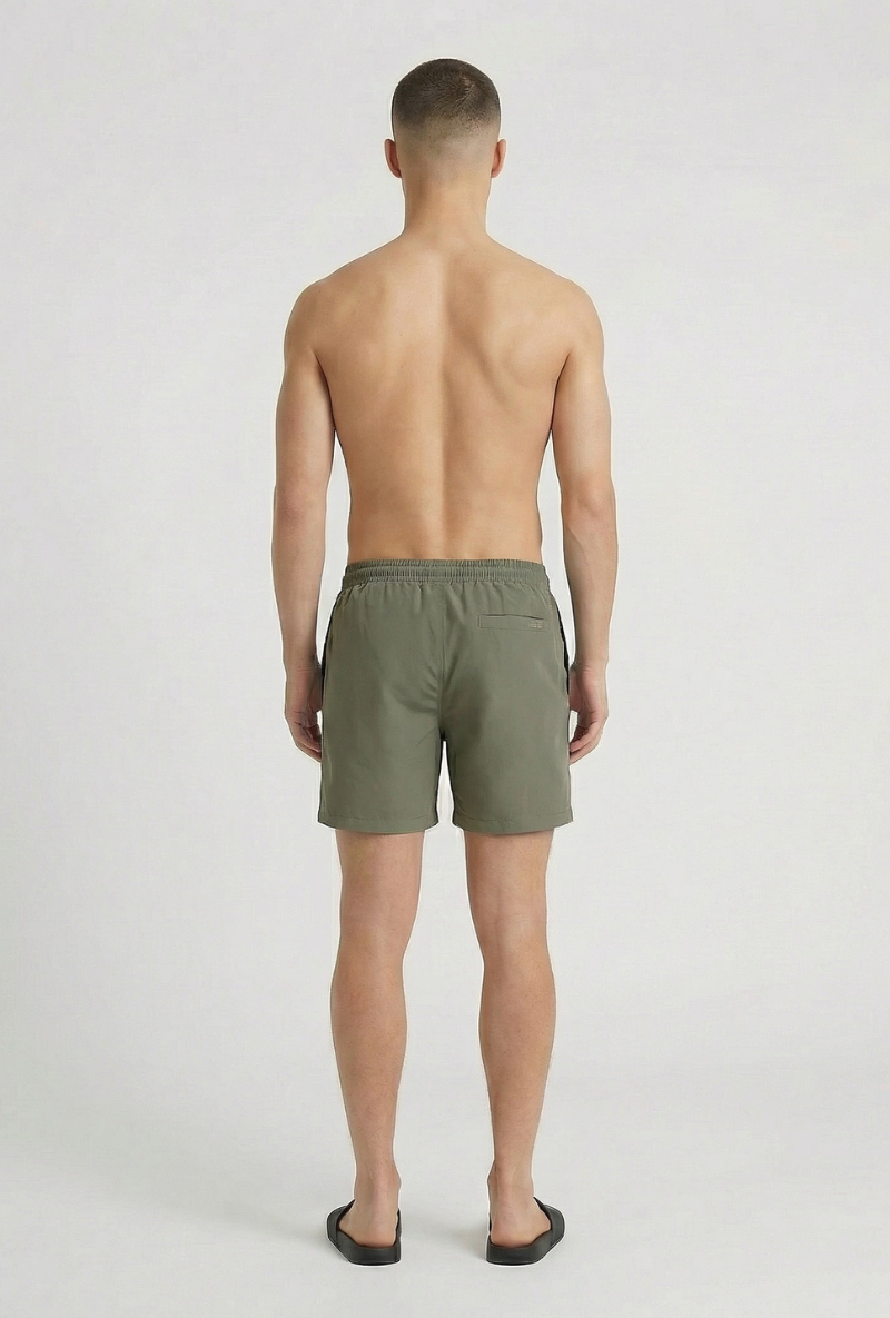 Back image of a model wearing Deep sharky swimshorts in khaki, by brand Deep