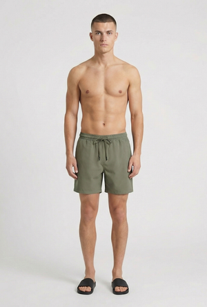 Front image of a model wearing the Deep sharky swimshorts in khaki, by brand Deep
