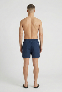 Back image of a model wearing the Deep sharky swimshorts in navy, by brand Deep