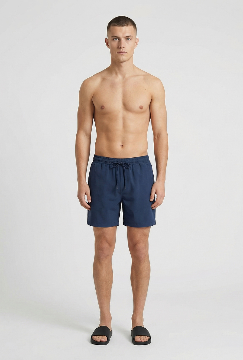 Front image of a model wearing Deep sharky swimshorts in navy, by brand Deep