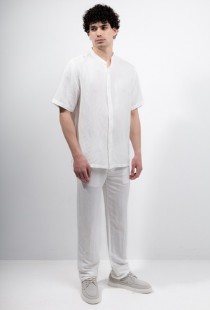 Front image of a model wearing the Deep strike linen shirt in off white, by brand Deep