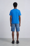 Back image of a model wearing the Deep troy s/s tshirt in blue, by brand Deep