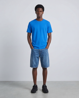Front image of a model wearing the Deep troy s/s tshirt in blue, by brand Deep