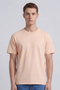 Front image of a model wearing the Deep troy s/s tshirt in peach, by brand Deep