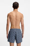 Back image of a model wearing the Hugo aaron swimshorts in navy, by brand Hugo