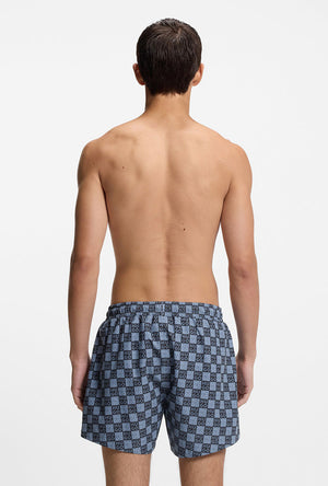 Back image of a model wearing the Hugo aaron swimshorts in navy, by brand Hugo