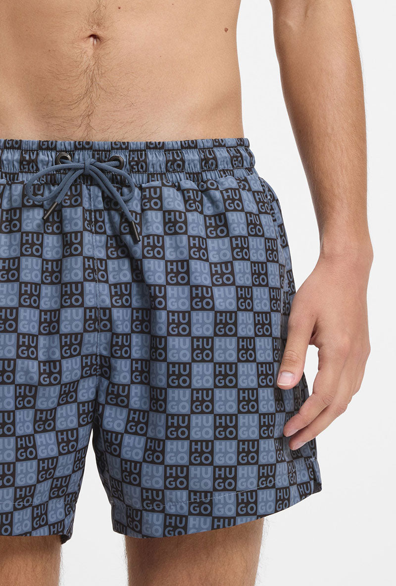 Front detail image of a model wearing Hugo aaron swimshorts in navy, by brand Hugo