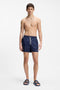 Front image of a model wearing the Hugo evander sandal in navy, by brand Hugo