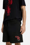 Front image of a model wearing the Dagety sweat shorts in black, by brand Hugo