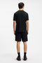 Back image of a model wearing the Dikerd t in black, by brand Hugo