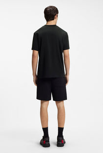 Back image of a model wearing the Dikerd t in black, by brand Hugo