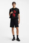 Front image of a model wearing the Dikerd t in black, by brand Hugo