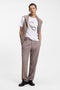 Front image of a model wearing the Discorb t in white, by brand Hugo