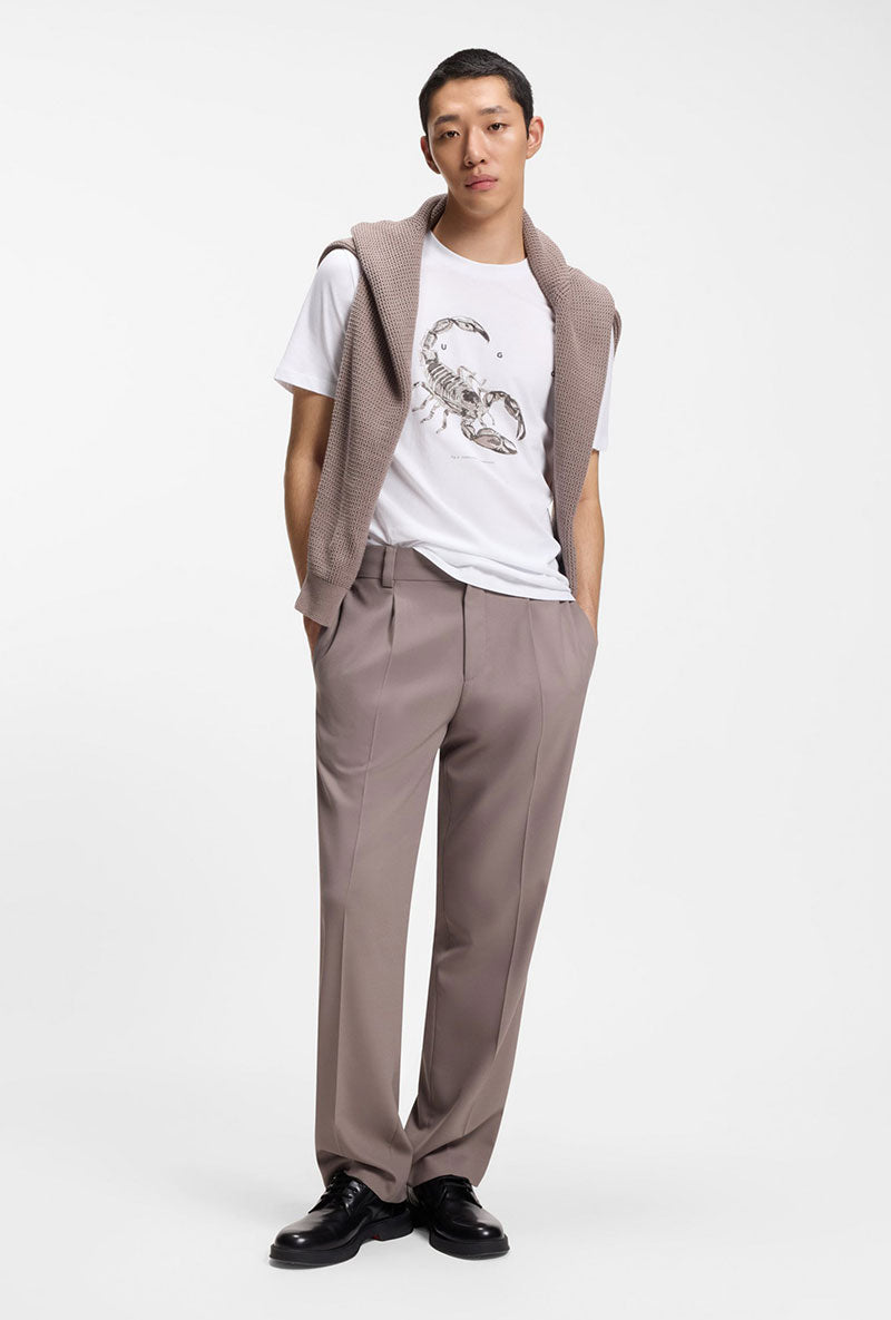 Front image of a model wearing Discorb t in white, by brand Hugo