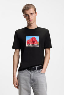 Front image of a model wearing the Dostino t in black, by brand Hugo