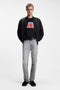 Front image of a model wearing the Dostino t in black, by brand Hugo