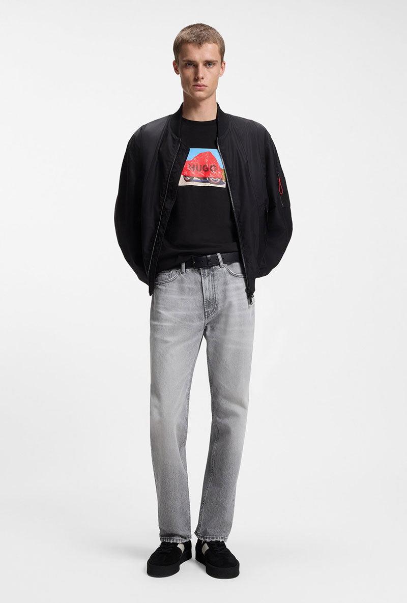 Front image of a model wearing Dostino t in black, by brand Hugo