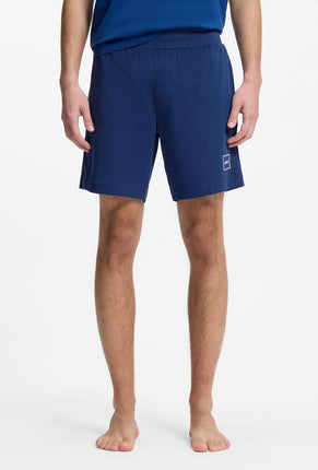 Front image of a model wearing Laze shorts in blue, by brand Hugo