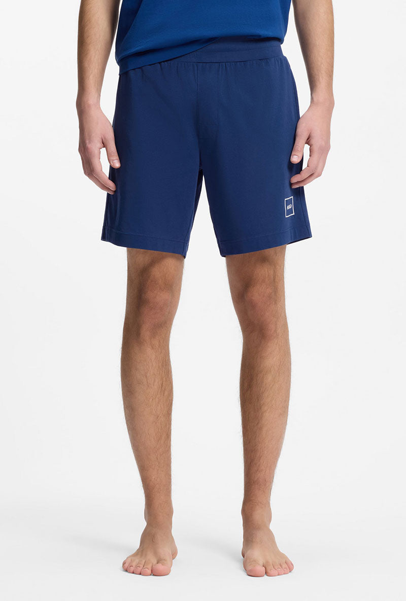 Front image of a model wearing Laze shorts in blue, by brand Hugo