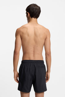 Back image of a model wearing the Paolo swimshorts in black, by brand Hugo